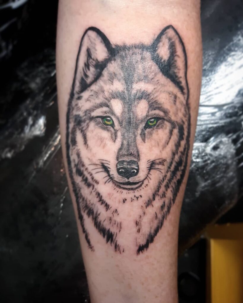 Adorable Green-Eyed Wolf Tattoo