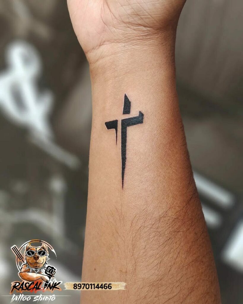 The Minimalistic Tiny Cross Tattoo