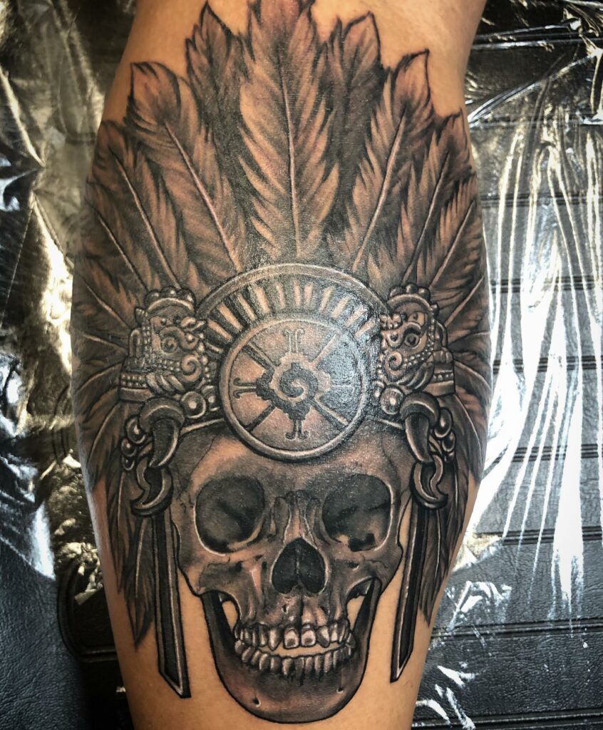 Blackwork Aztec God Skull Tattoo Idea  BlackInk