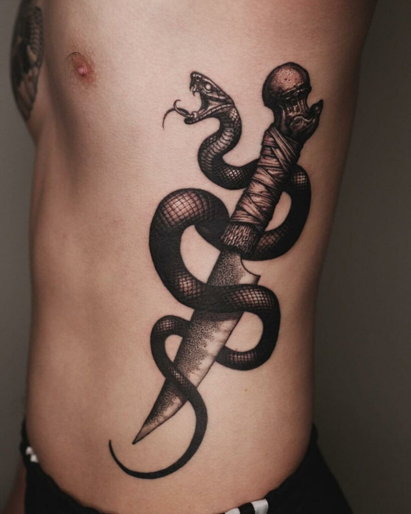 Beautiful and Fierce Snake and Dagger Tattoo