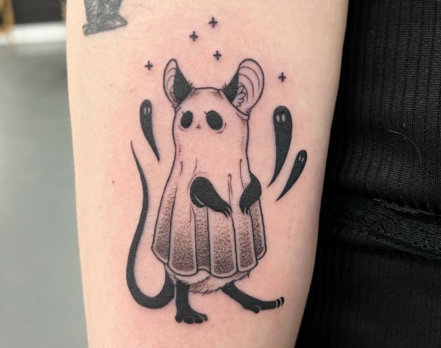 Minimalistic style ghost tattoo located on the inner