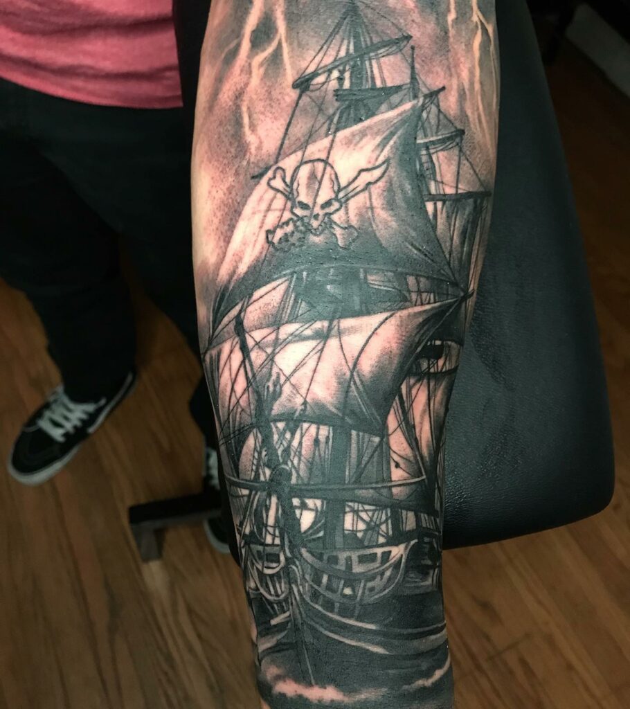 Black And Grey Pirate Ship Tattoo Forearm