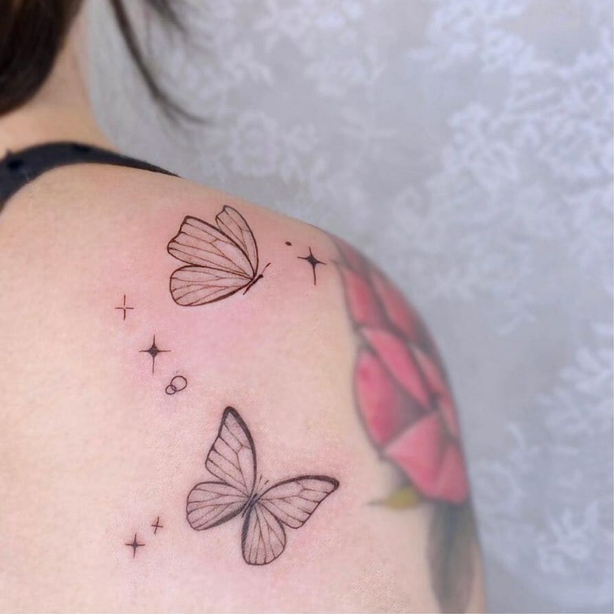 Black Butterflies Tattoo With An Additional Flower