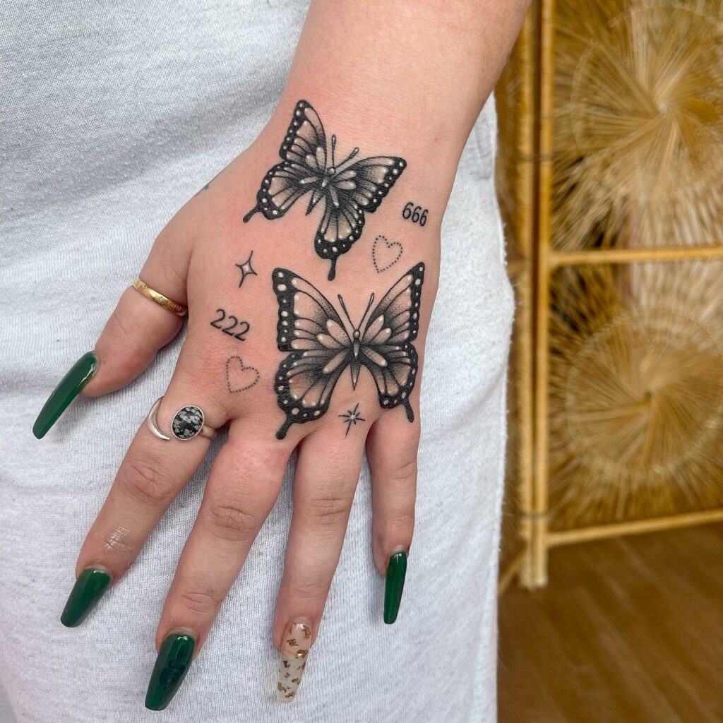 2 big Black butterfly hand tattoo