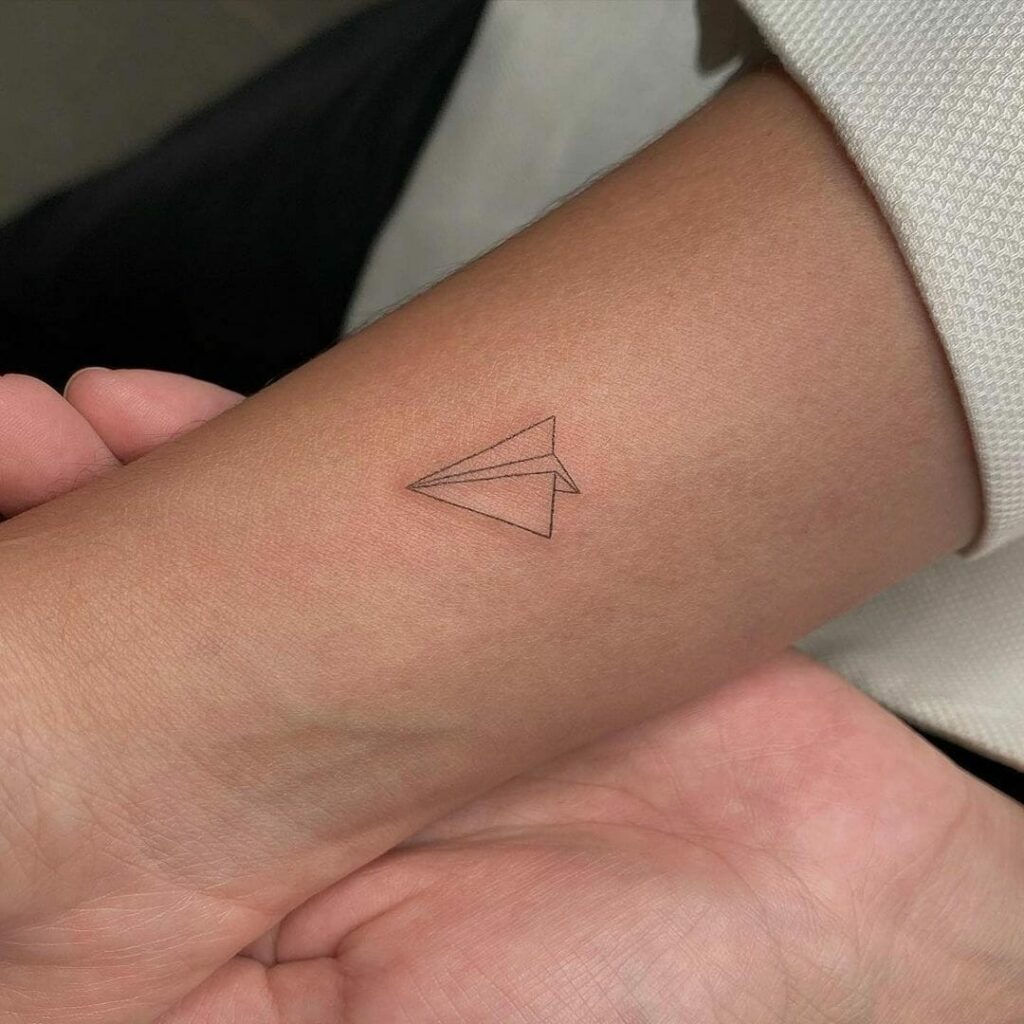 Black Paper Plane Outline Tattoo