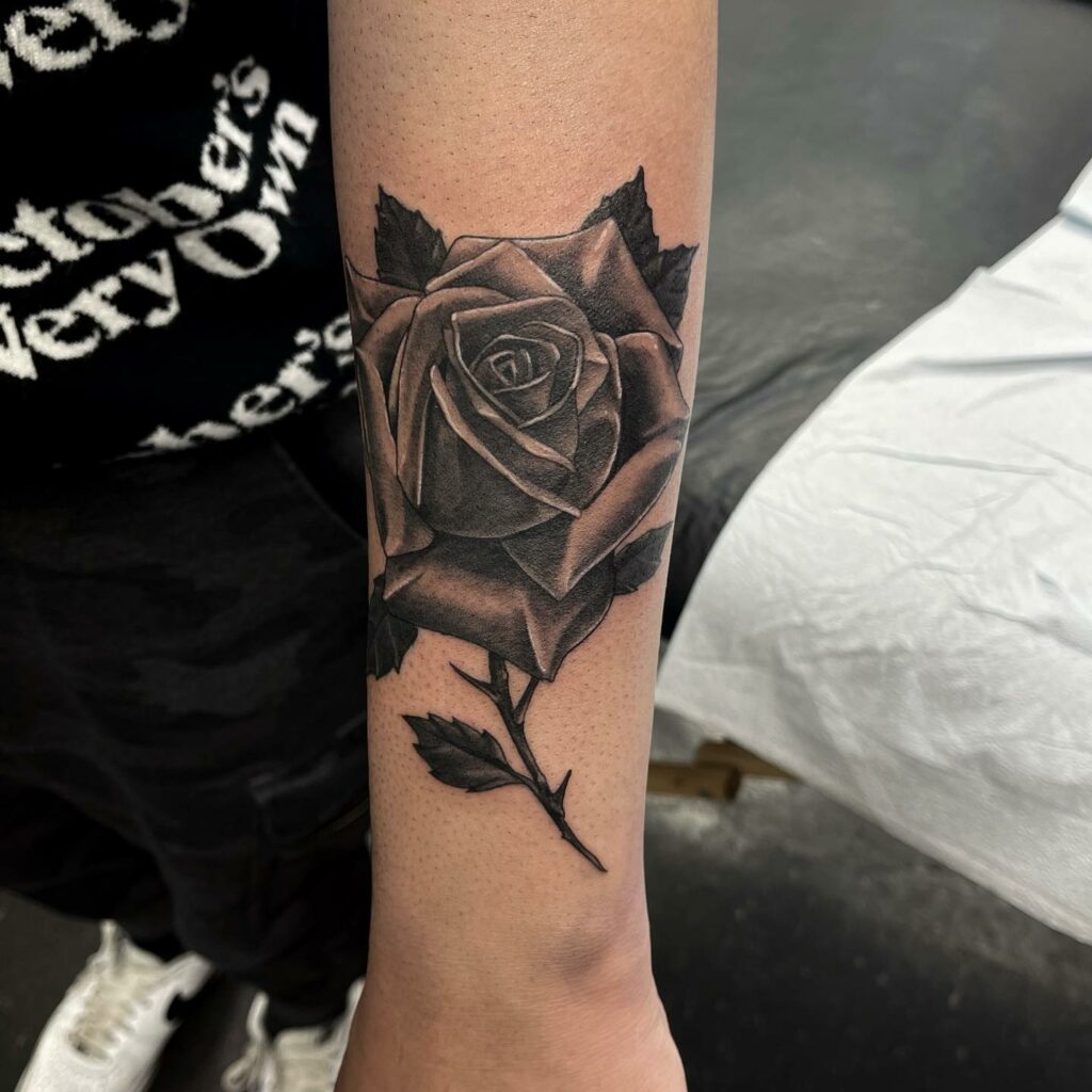 Black Rose Tattoo With Intricate Detailing