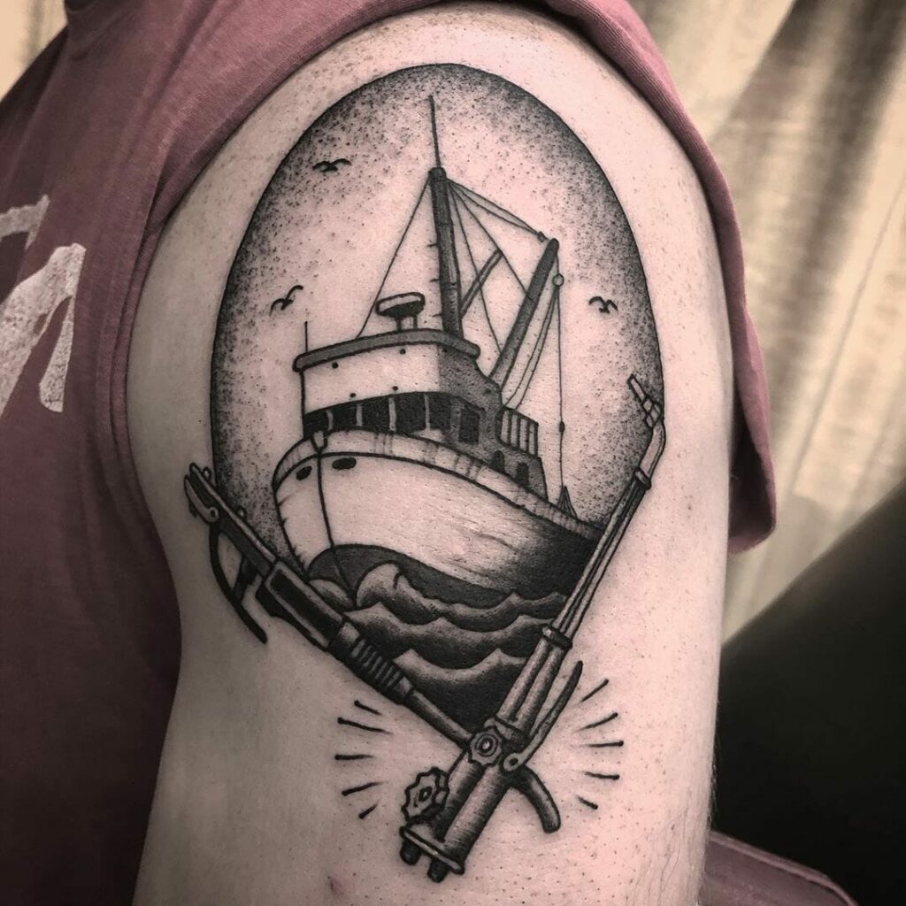Black and Gray Military Ship Tattoo