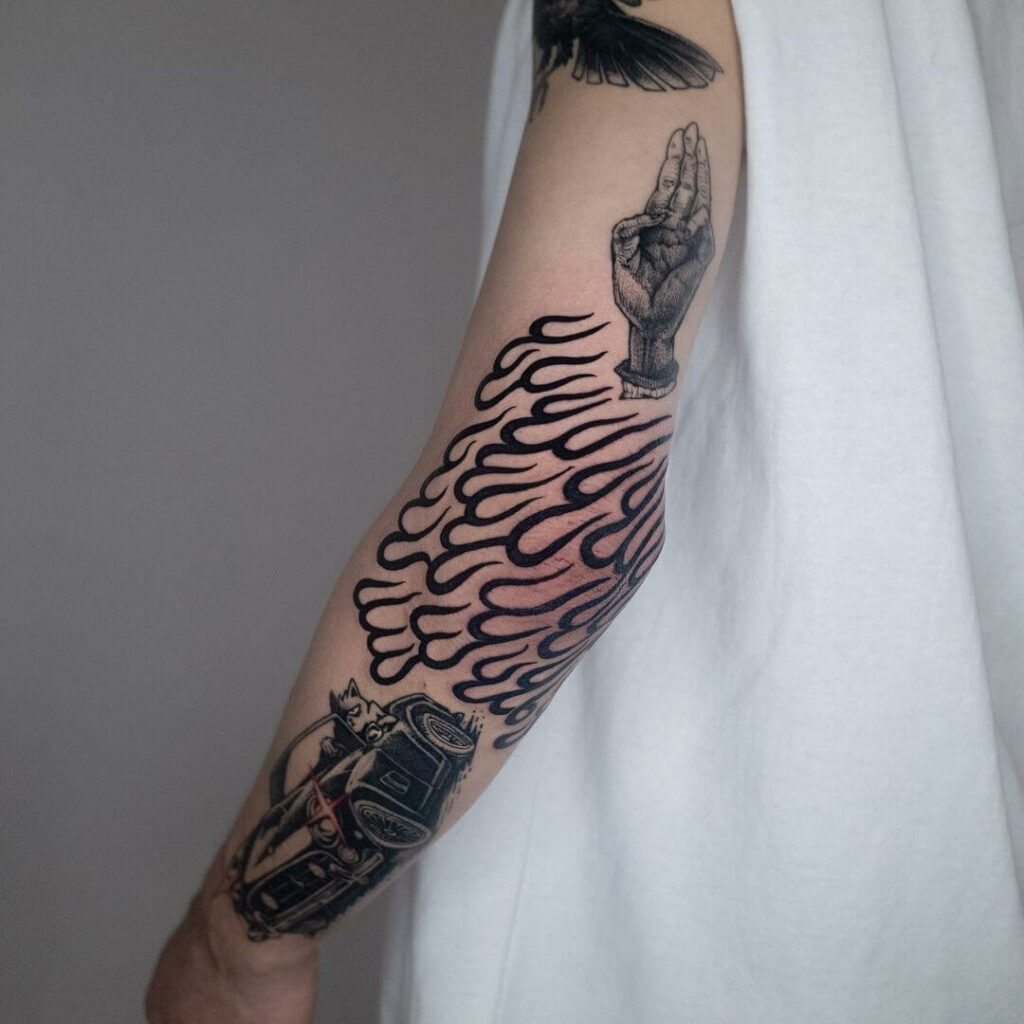 Bold Elbow Fire Tribal Tattoo