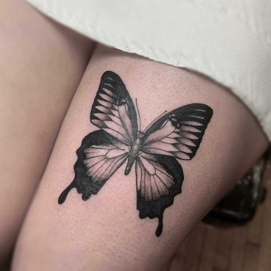 Butterfly Above The Knee Tattoo