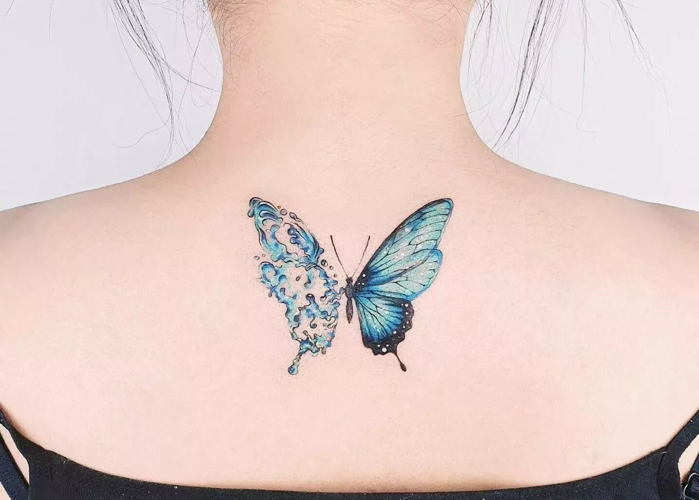 Back small butterfly tattoo