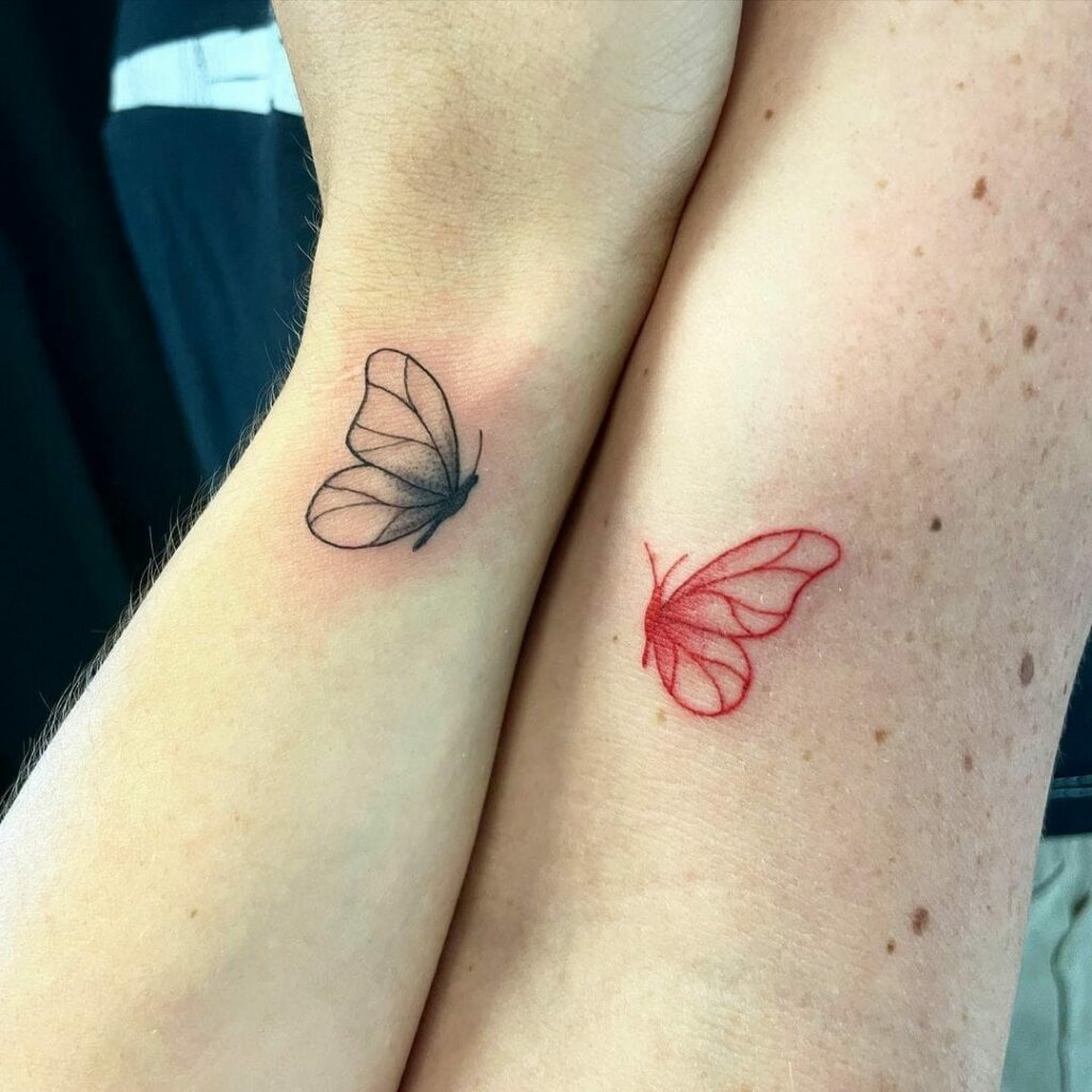 Butterfly couple tattoo on the left forearm