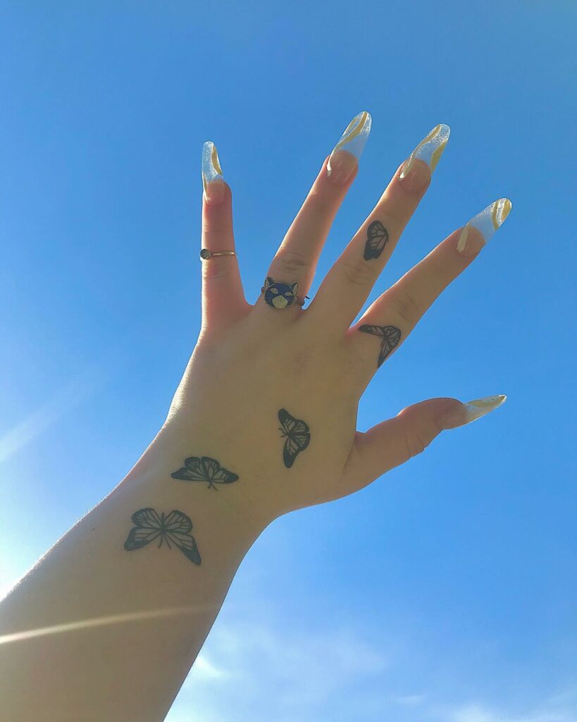 Butterfly Tattoo On Finger