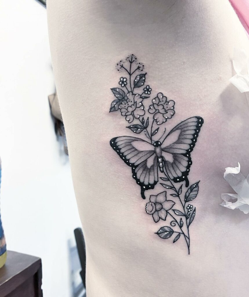 Butterfly With Flowers On Branch Tattoo