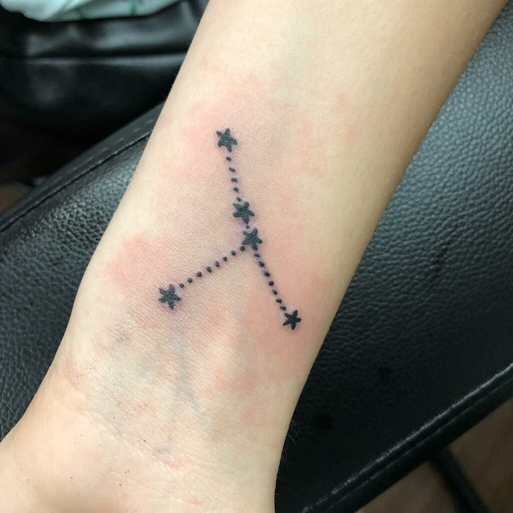 Cancer constellation tattoo on the wrist