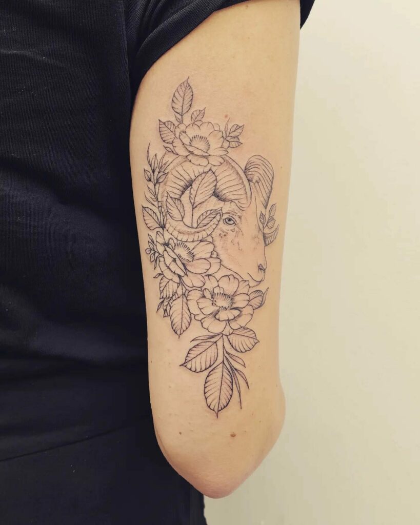 Capricorn Amidst Flowers Tattoo