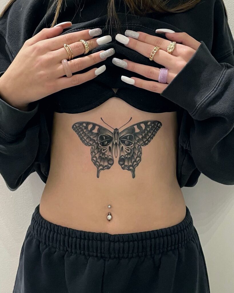 Microrealistic butterfly tattoo on the rib