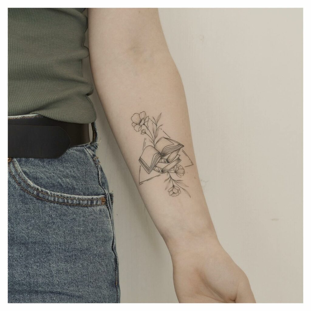 Combination Of Books And Flower Tattoos