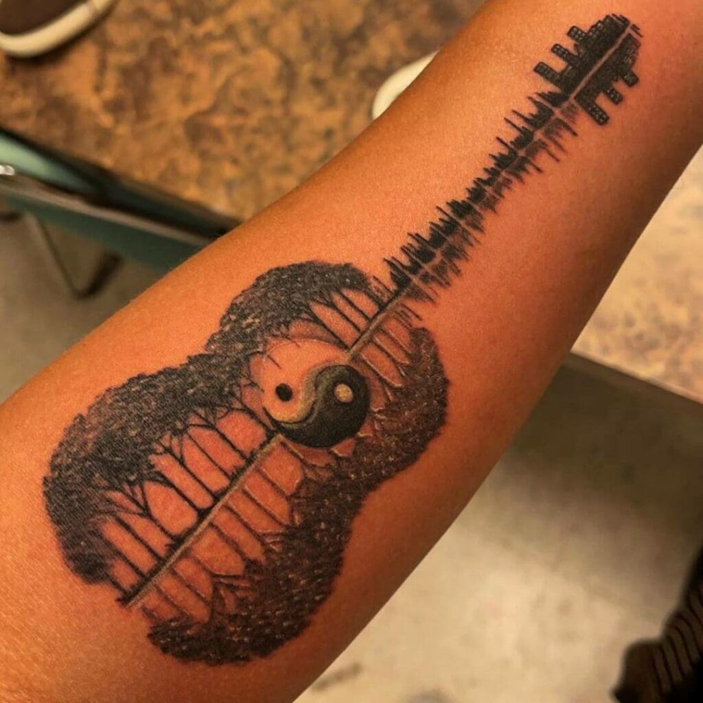 Cool Meaningful Tattoo With A Yin-Yang Guitar
