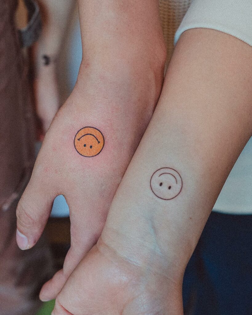 Couple Tattoo Of A Smiley Face
