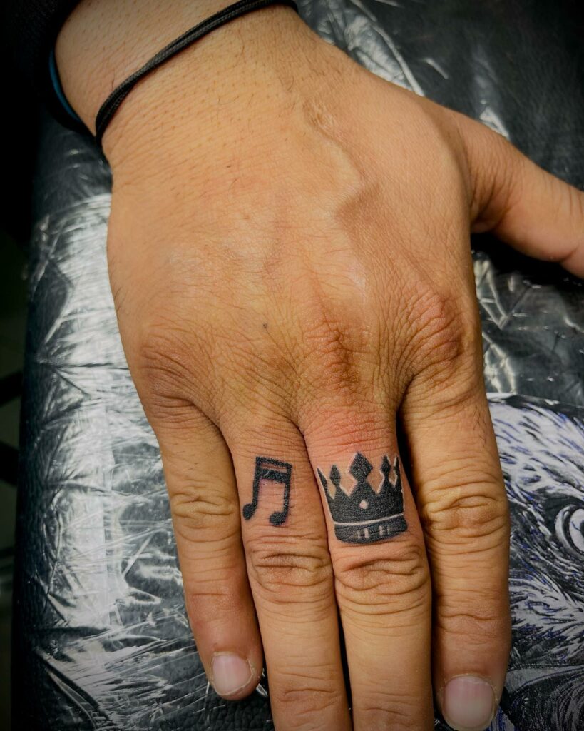 Crown Finger Tattoo