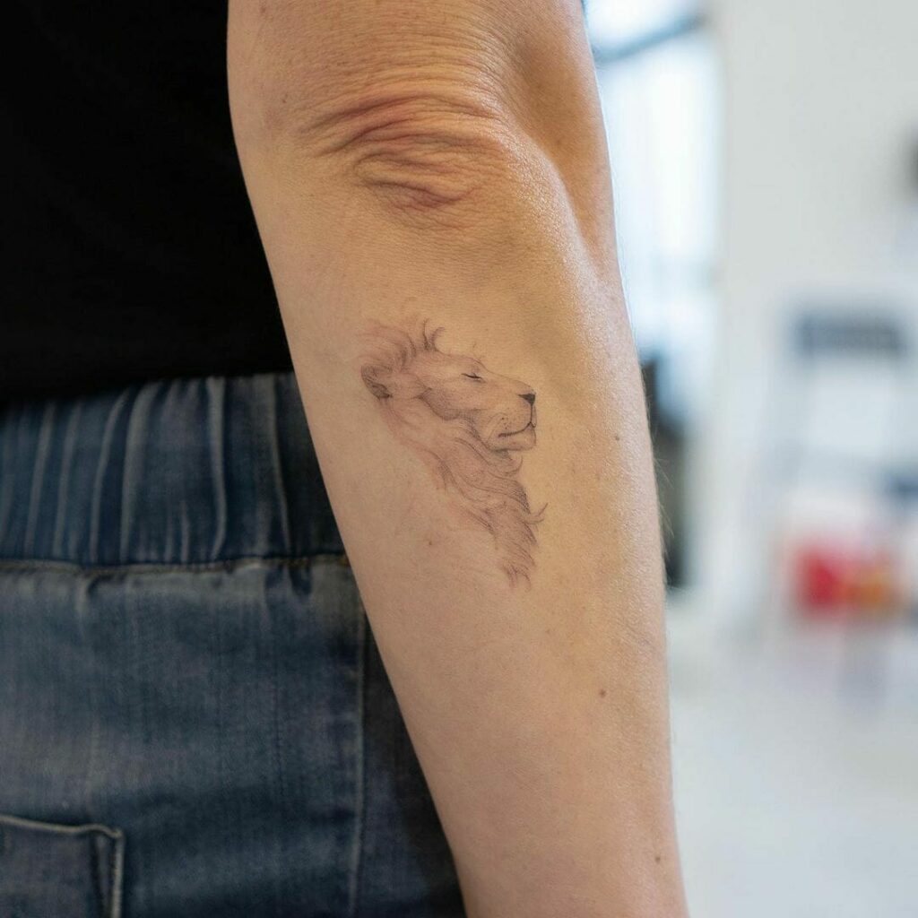 Cute Small Delicate Lion Tattoo