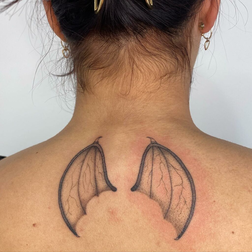 Demon Wings On The Neck Tattoo For Women