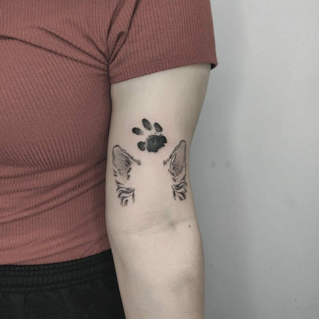 dog paw tattoo behind ear