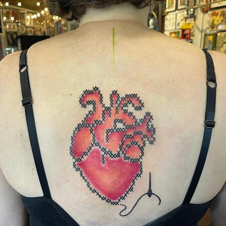 Elaborate Cross Stitch Tattoo Designs For Your Back