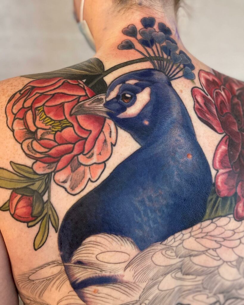Elegant Blue Peacock Tattoo on Back