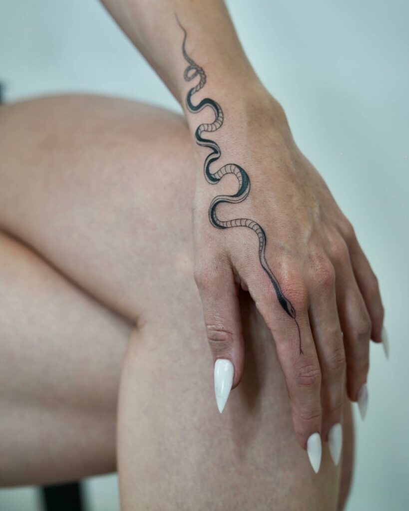 Elegant Snake Tattoo On Finger ideas