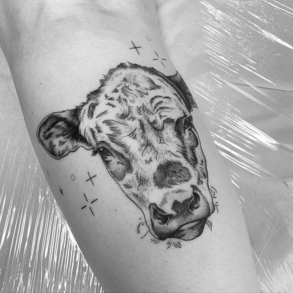 Emotional Black Inked Cow Tattoo