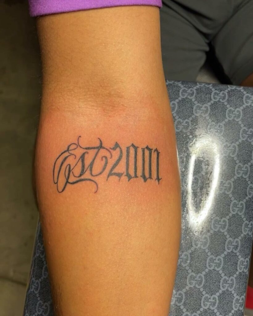 Est 2001 Tattoo In Cursive Font