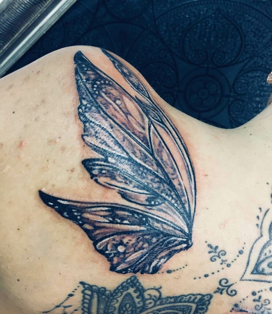 Fancy Fairy Tattoo Featuring A Single Wing