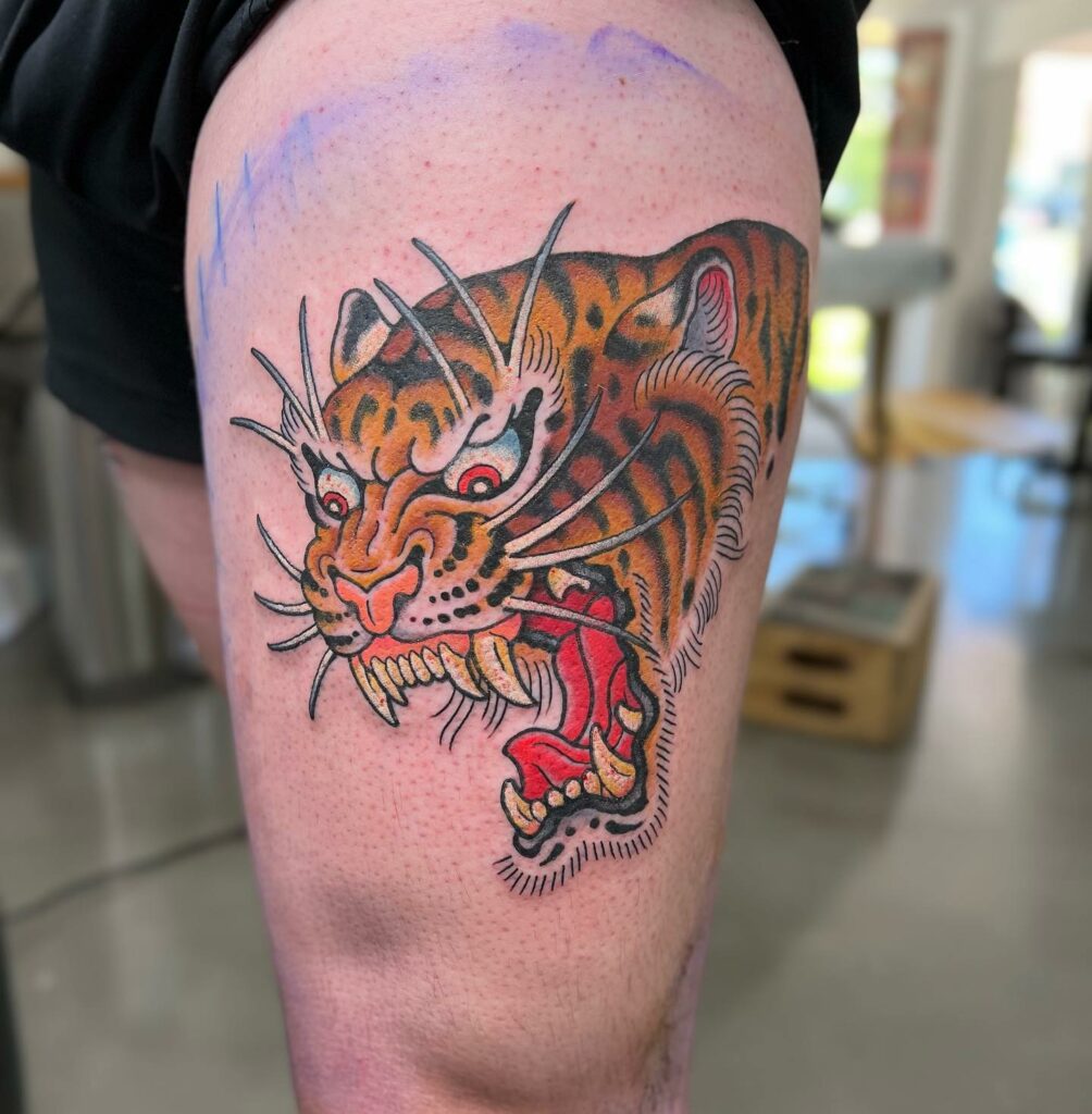 Fierce Tiger Thigh Tattoo