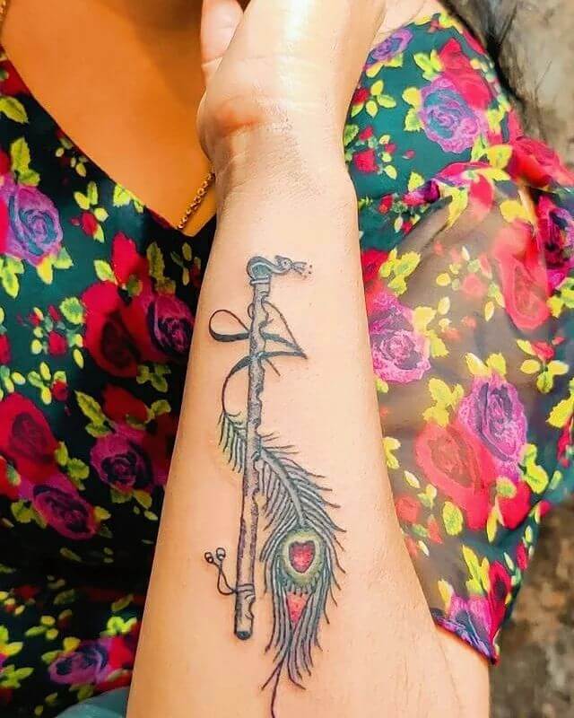 Flute and Peacock Feather Tattoo