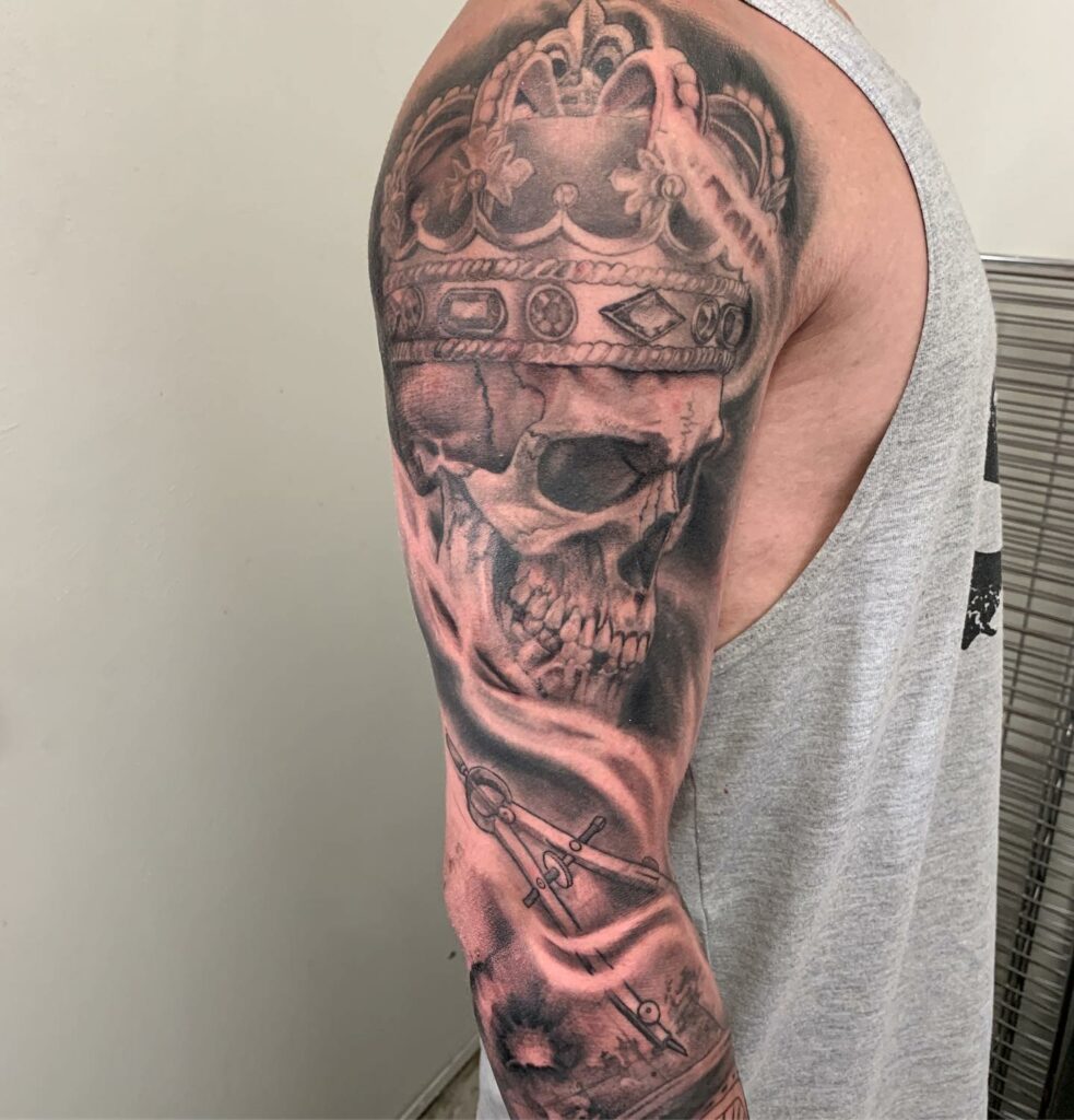 Full Sleeve Skull And Crowns Tattoo