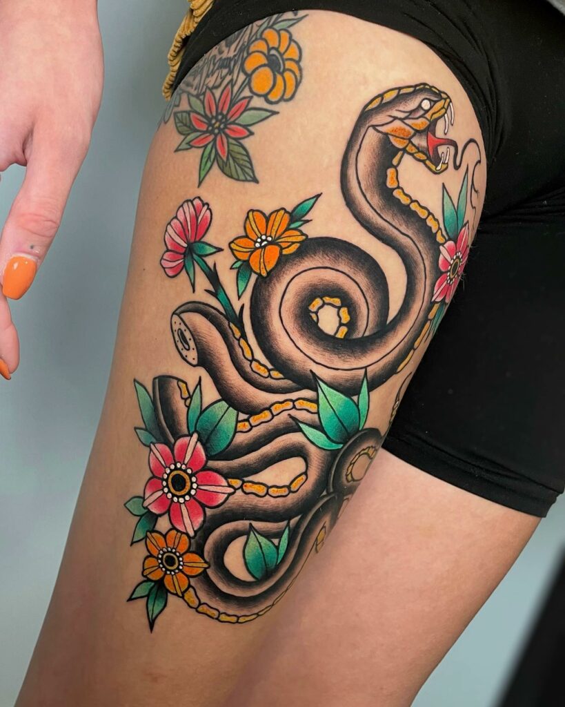 Full Thigh Snake Tattoo With Colorful Flowers