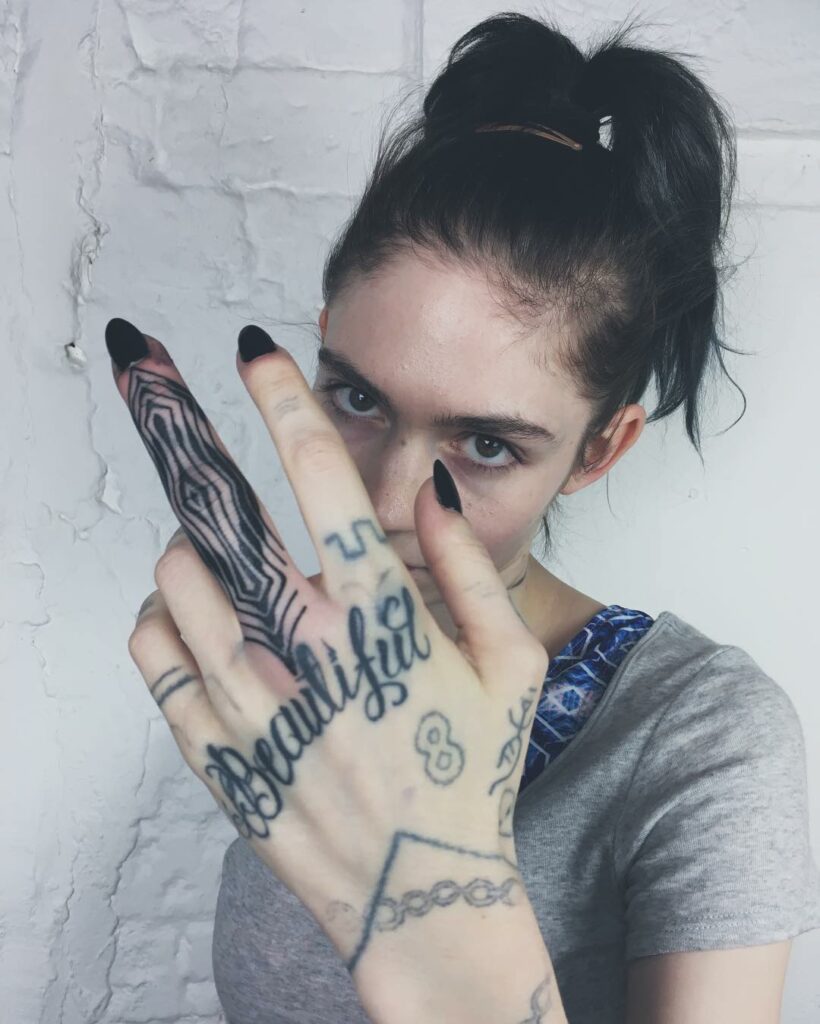 Grimes Finger Tattoos