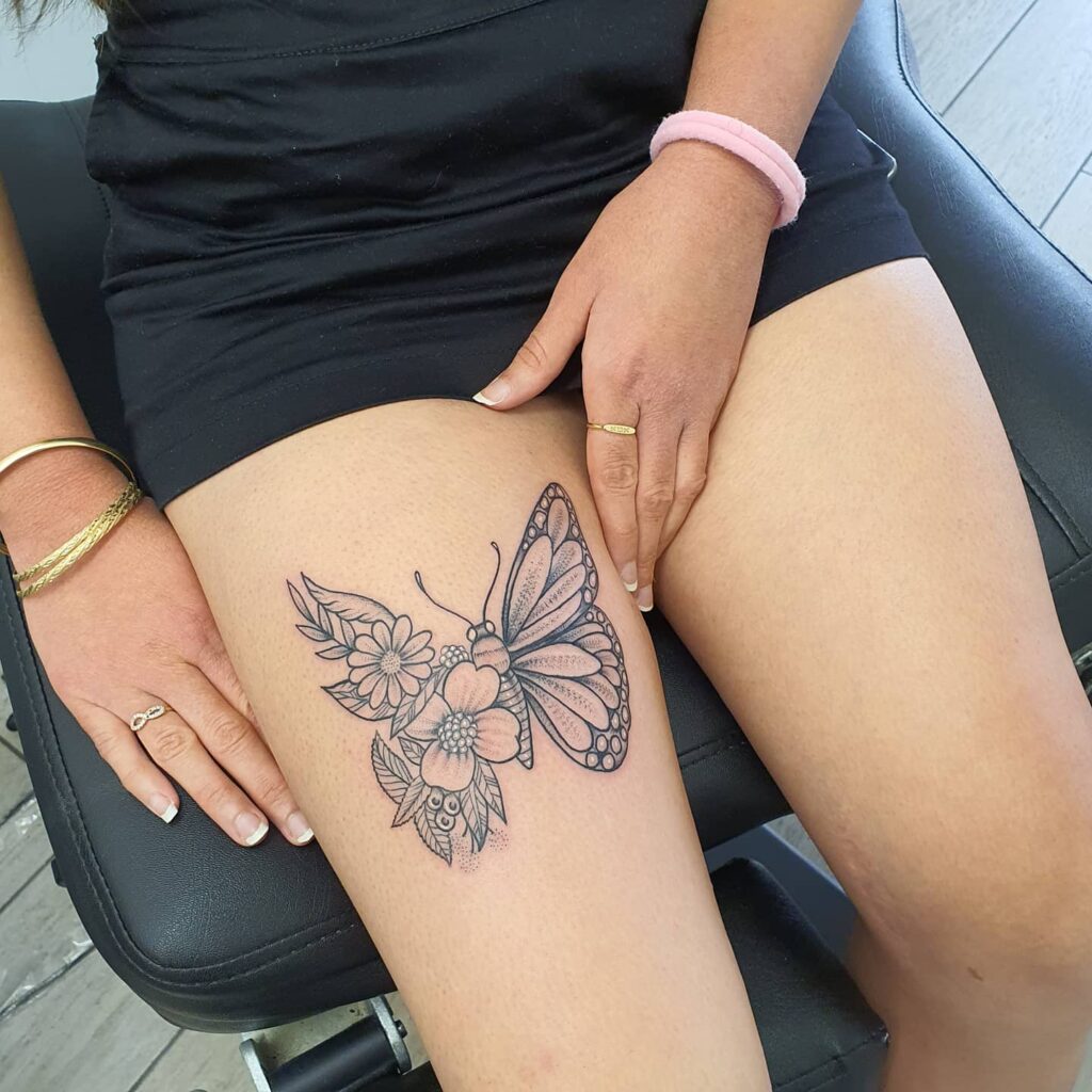 butterfly flower hip tattoos