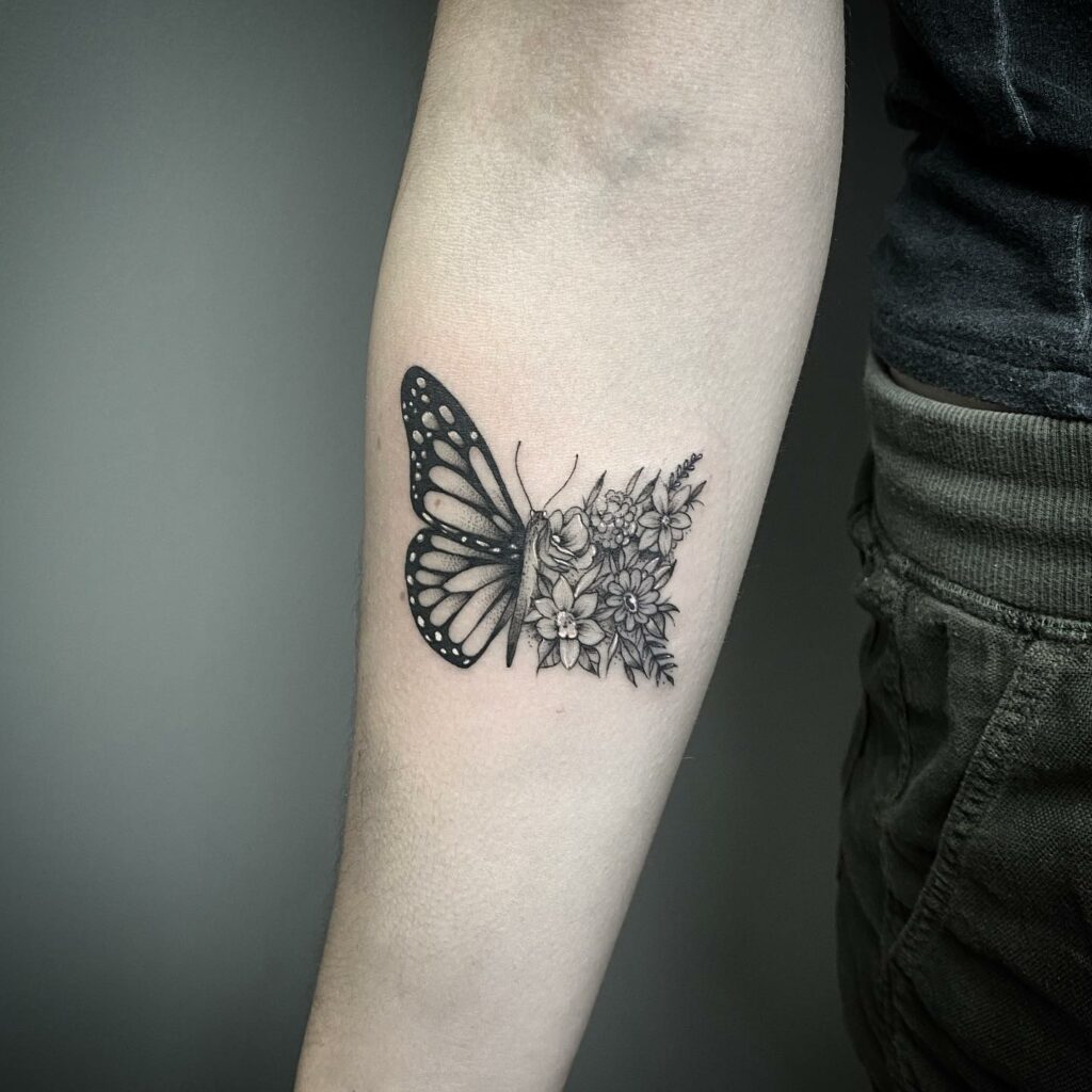 Half Butterfly Tattoo With Floral Design In Black