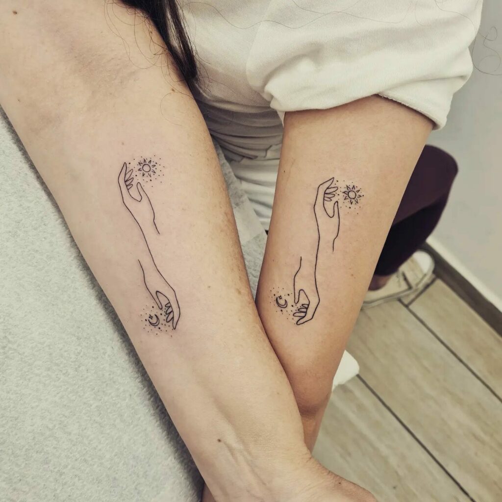 Hand Holding Sun And Moon Matching Tattoo