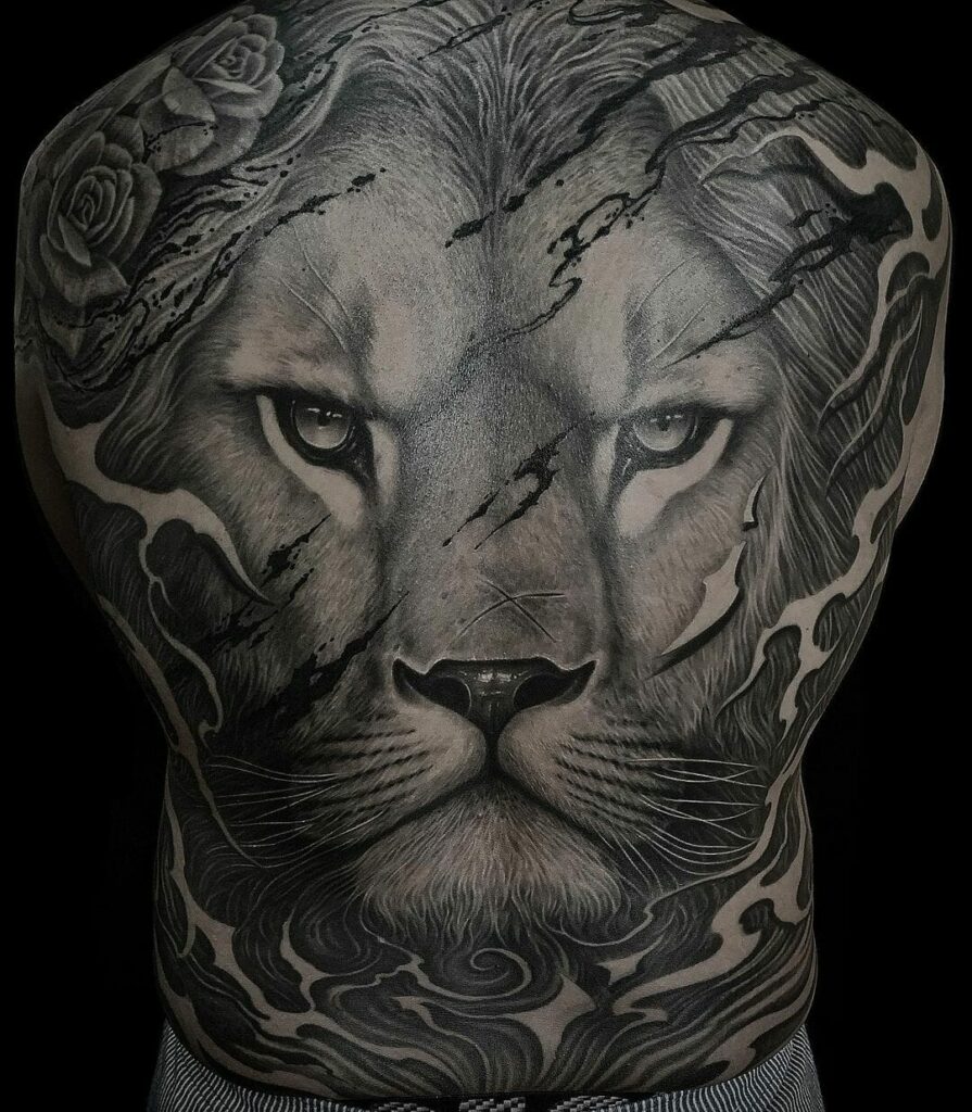Incredible Lion Back Piece Tattoo