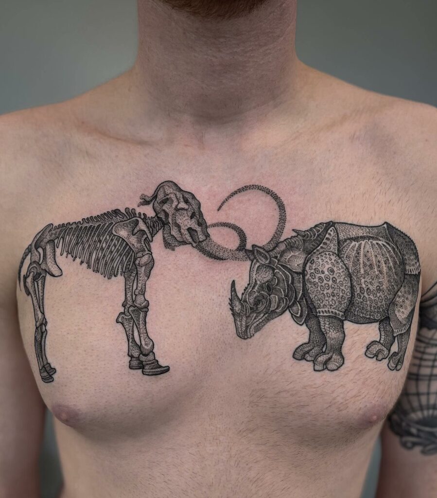 Mammoth And Rhino Chest Tattoo