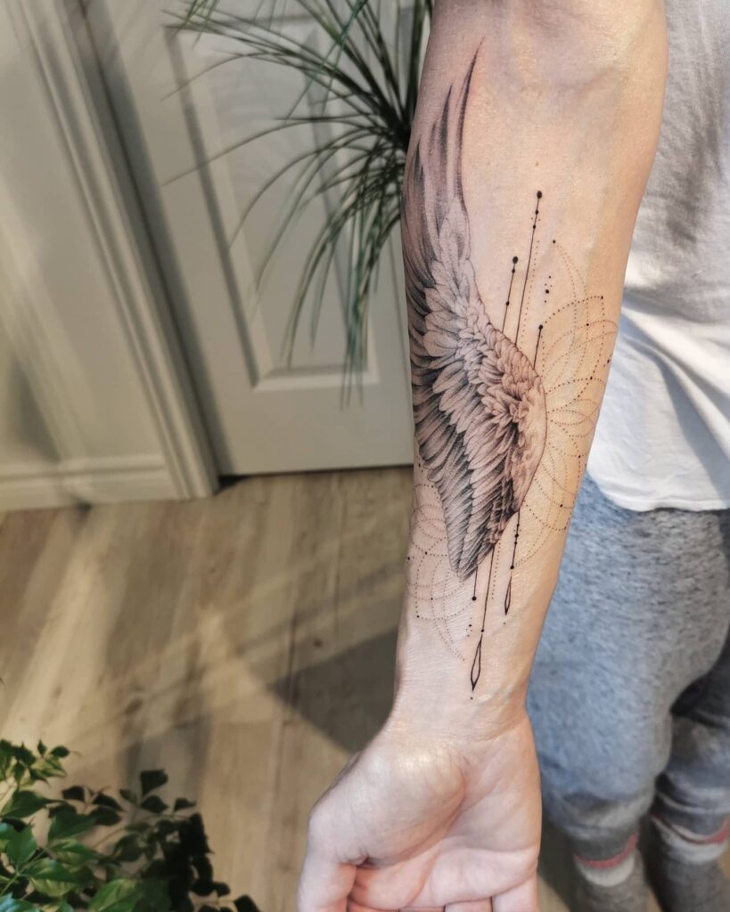 Angel Wings Tattoo On Left Forearm