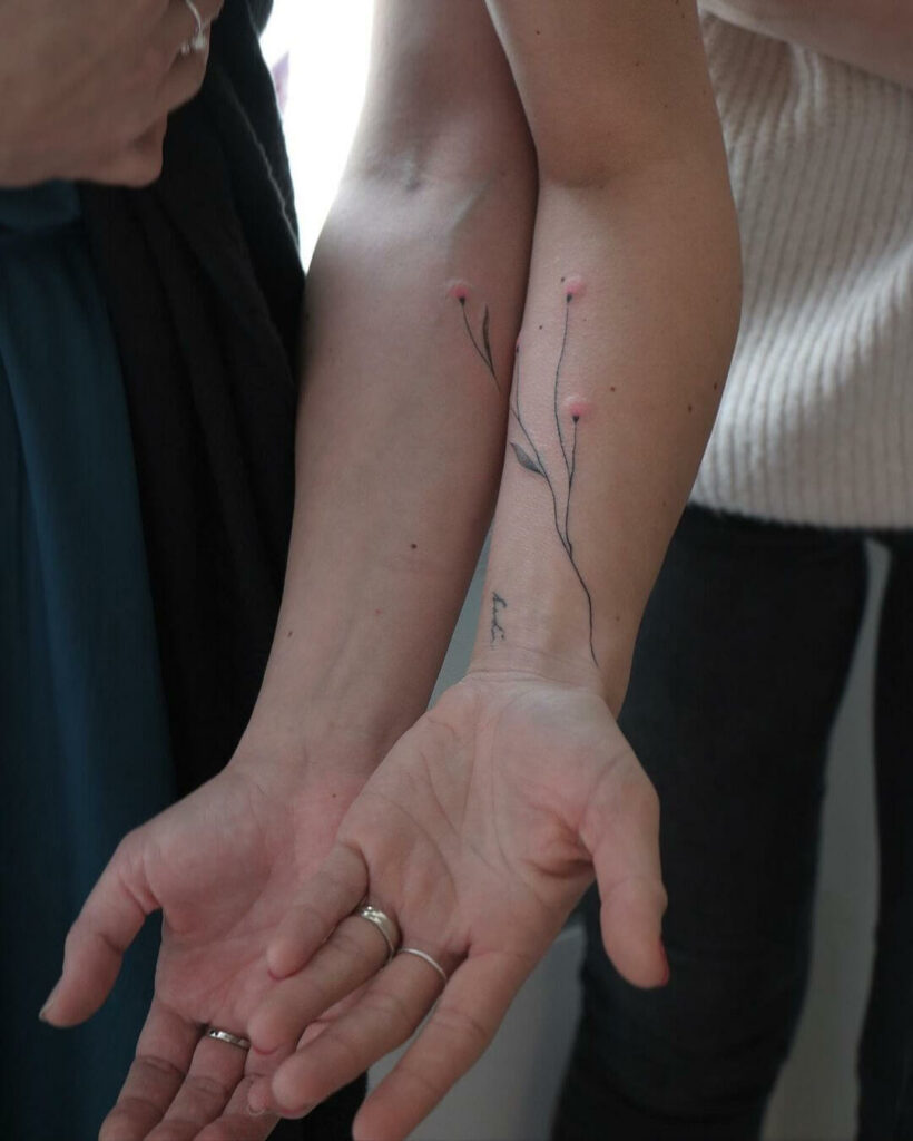 Matching Couple Tattoo With Colourful Detailings