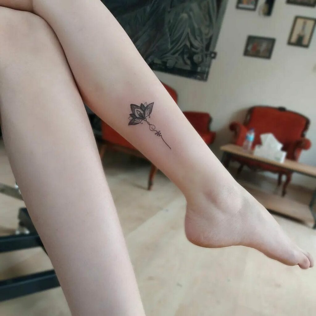 Meaningful Small Female Strength Symbol Tattoo