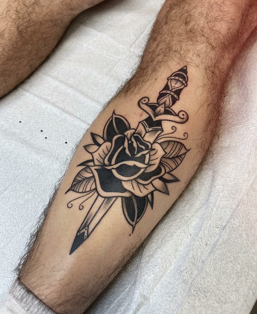 Medieval Sword Piercing Through Rose Tattoo