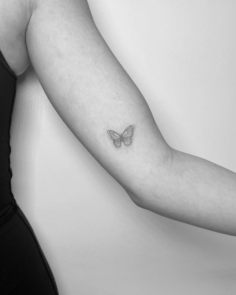 Minimal Butterfly Bicep Tattoo