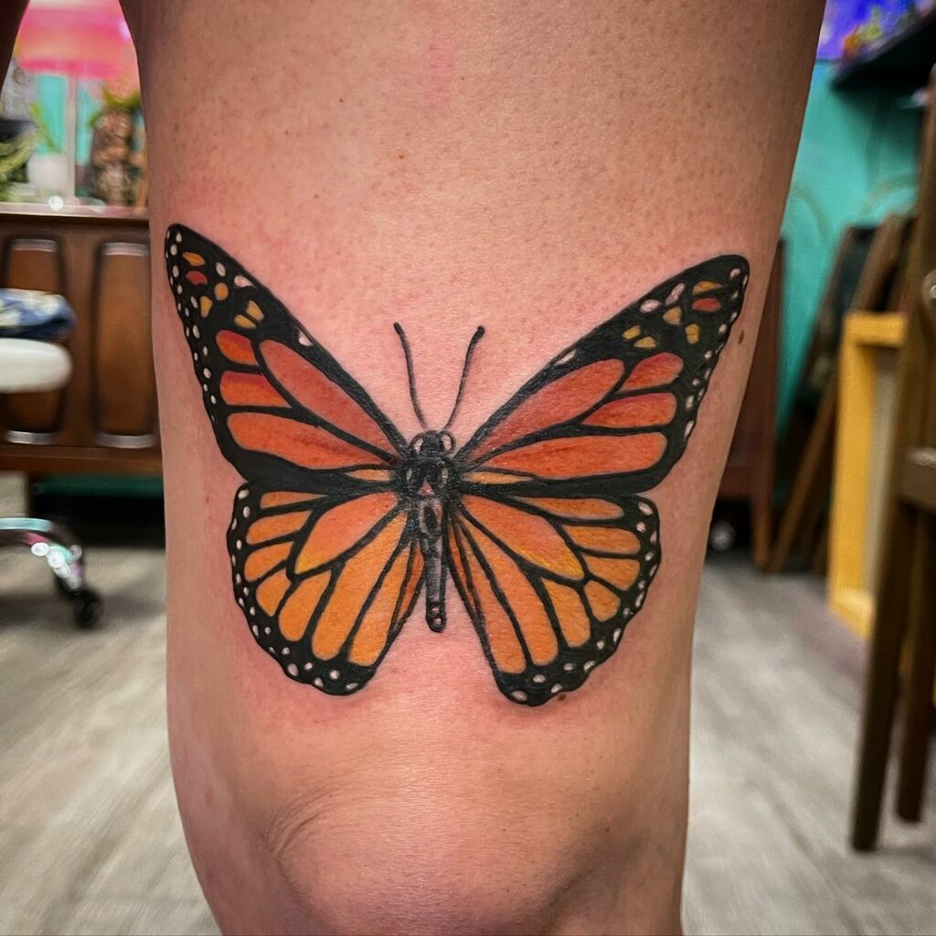 Monarch butterfly tattoo thigh