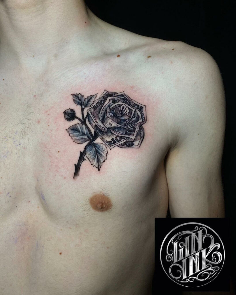 Black Ink Money Rose With Banner Tattoo On Man Left Chest